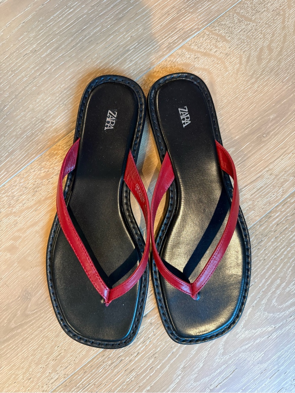 Like new red and black leather flip flops